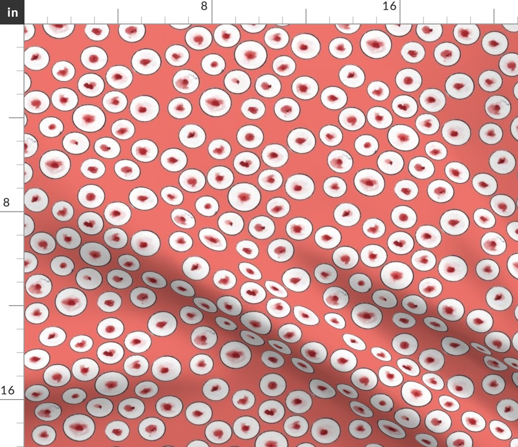 black circles on coral background