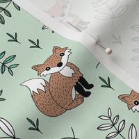 Little fox woodland summer forest and lush green leaves baby nursery design mint boys