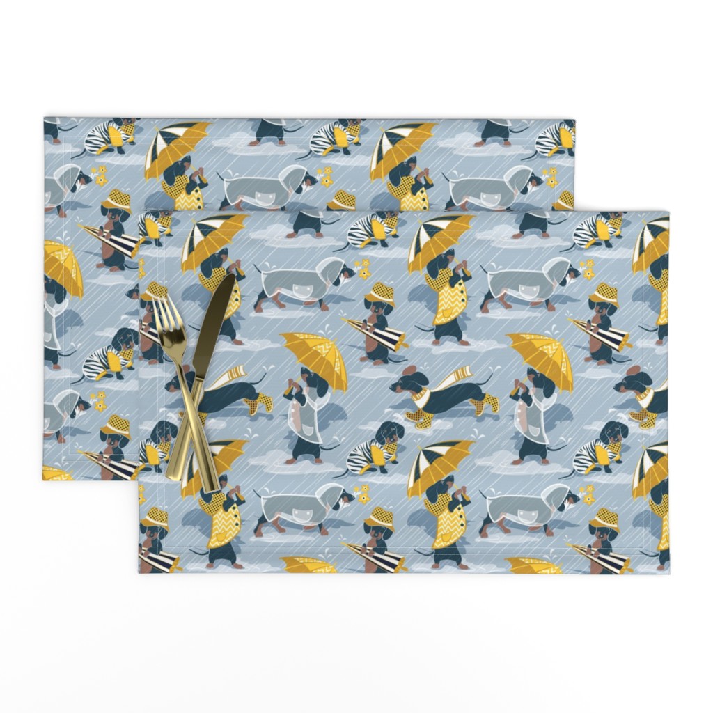 Small scale // Ready For a Rainy Walk // pastel blue background navy blue dachshunds dogs with yellow and transparent rain coats and umbrellas 