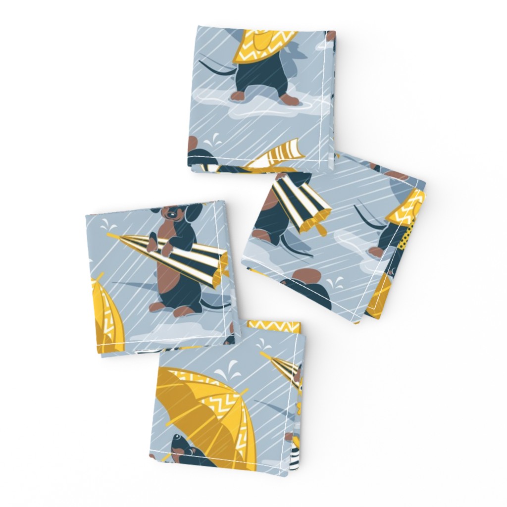 Normal scale // Ready For a Rainy Walk // pastel blue background navy blue dachshunds dogs with yellow and transparent rain coats and umbrellas