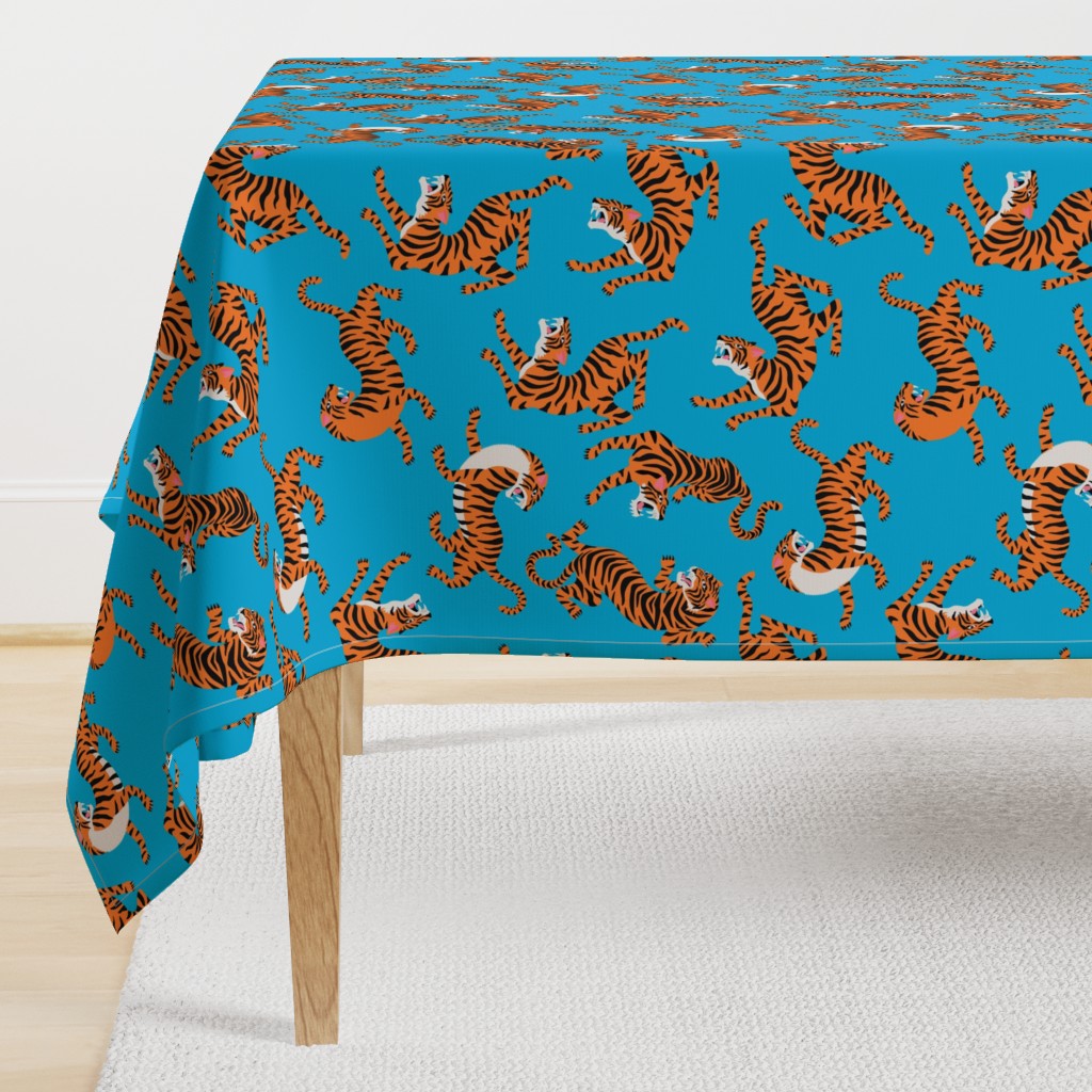 Tigers Dancing on Blue Background and Orange Animal Print Champs on Fading or Gradient Background