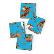 Tigers Dancing on Blue Background and Orange Animal Print Champs on Fading or Gradient Background