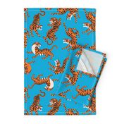 Tigers Dancing on Blue Background and Orange Animal Print Champs on Fading or Gradient Background