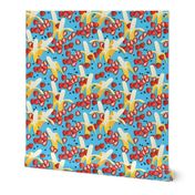 Bananas, strawberries, blueberries on a light blue background