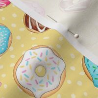 Scattered Rainbow Donuts on lemon yellow spotty