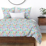 Rainbow Scattered Donuts on spotty pale blue - medium scale