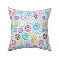 Rainbow Scattered Donuts on spotty pale blue - medium scale