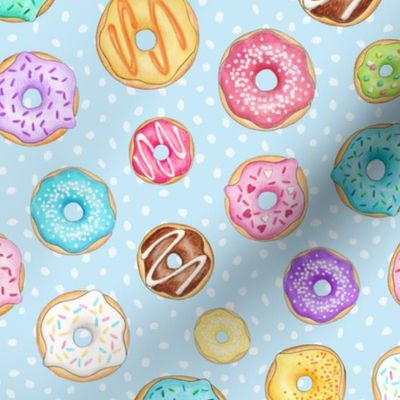 Rainbow Scattered Donuts on spotty pale blue - medium scale