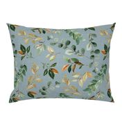 magnolia leaves and branches on blue linen