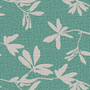 Natural leaves on mint green coloured linen