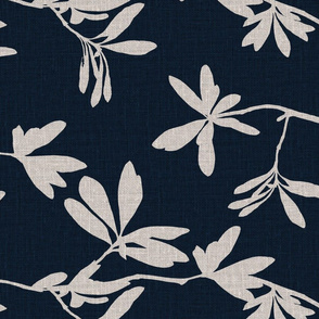 Natural leaves on navy blue coloured linen