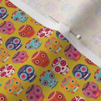 Colorful Sugar Skulls on Yellow Background