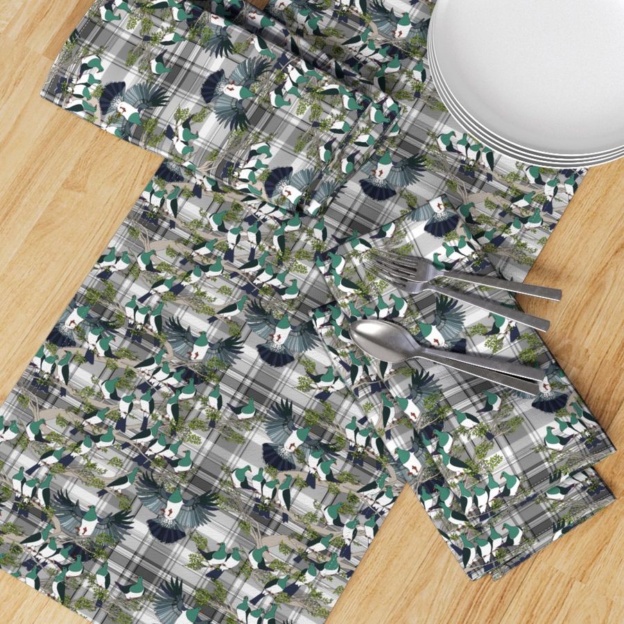 Kereru on grey plaid