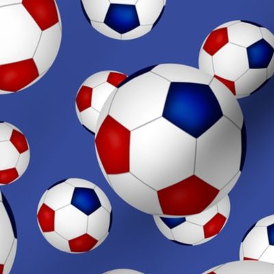 Red white and blue soccer balls on blue - large