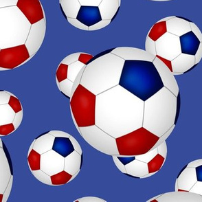 Red white and blue soccer balls on blue - large