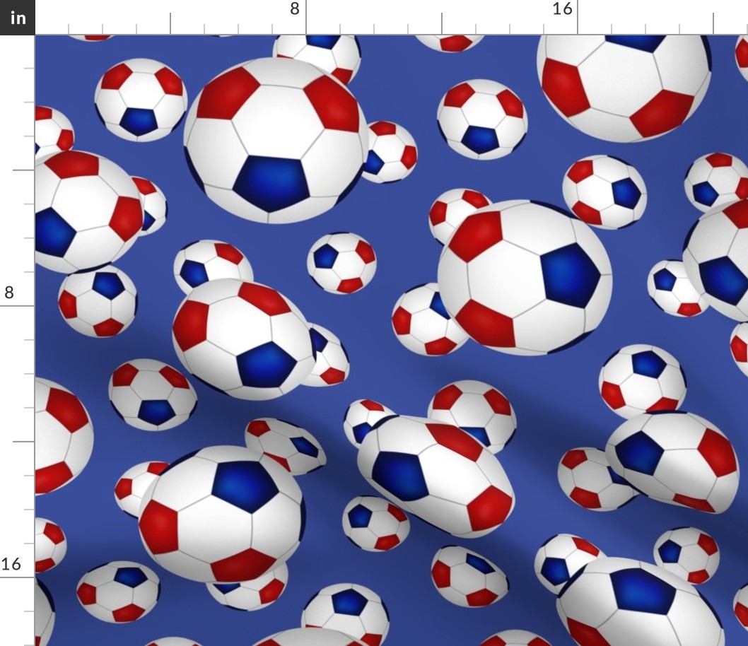 Red white and blue soccer balls on blue - large