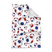 Red white and blue soccer balls on white - large