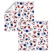 Red white and blue soccer balls on white - large