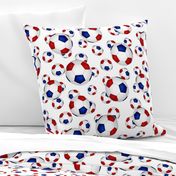 Red white and blue soccer balls on white - large