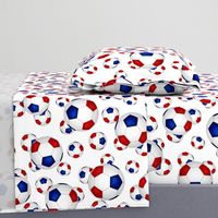 Red white and blue soccer balls on white - large