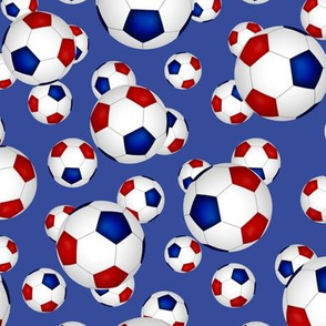 Red white and blue soccer balls on blue - small