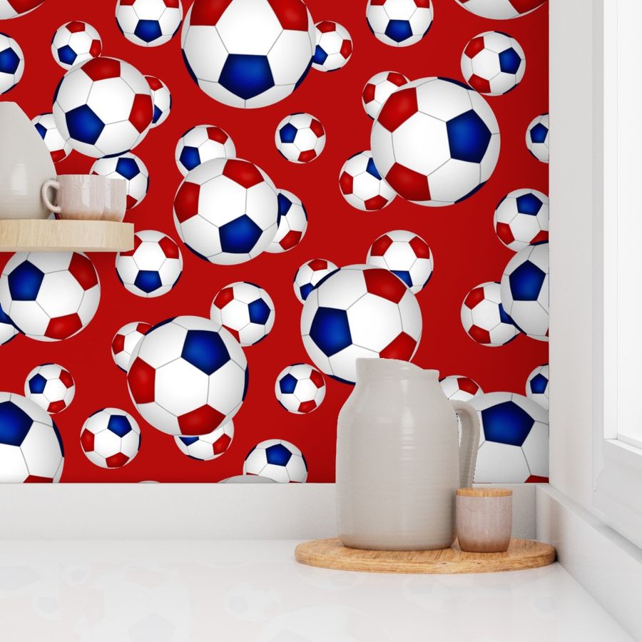 Red white and blue soccer balls on red - large