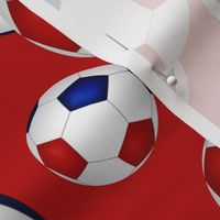 Red white and blue soccer balls on red - large