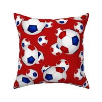 Red white and blue soccer balls on red - large