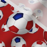 Red white and blue soccer balls on red - small