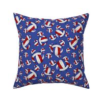 Red white and blue volleyballs on blue - small