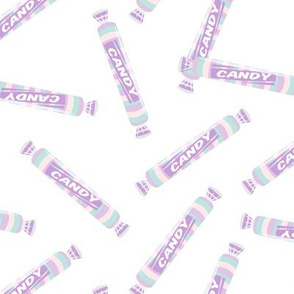 candy rolls -  tablet candy - pastel purple toss on white - LAD19