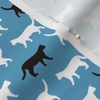 Walking Cats Silhouettes white on blue