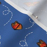 breezy floating Monarch butterflies on blue - smaller