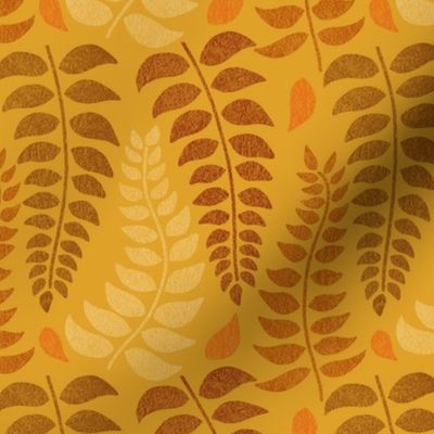 leaf fronds in fall colors on mustard