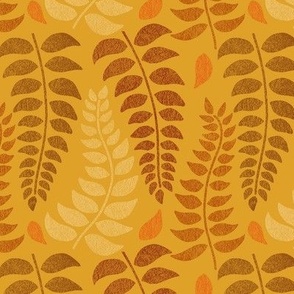 leaf fronds in fall colors on mustard