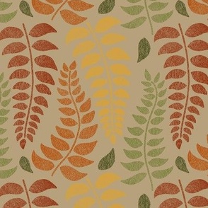 leaf fronds in fall colors on tan