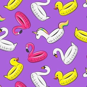 pool floats (swan, flaming, duck, unicorn) on purple