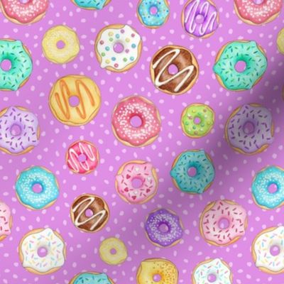 Scattered Rainbow Donuts on bright purple spotty