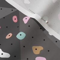 Climbing lovers bouldering gym wall with hold and boulders colorful pink girls