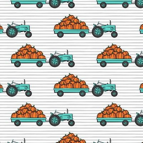 Pumpkin Patch -  bright teal tractor (on stripes) pulling pumpkins - LAD19