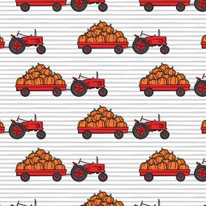 Pumpkin Patch - Red tractor (grey stripes) pulling pumpkins - LAD19