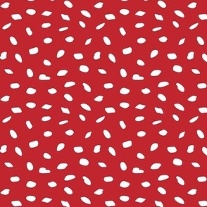 Tiny white dots over red background