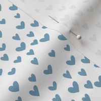 Small blue heart on white background