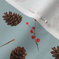 Pine cones red berries on verdigris gray