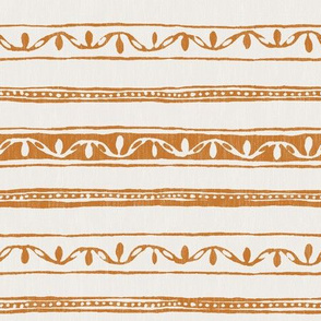 small lines and dots in ochre on cream linen