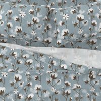 Cotton pods on grey blue