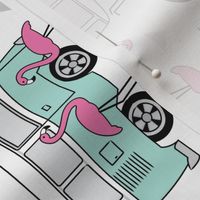 rotated camper van and flamingo on white