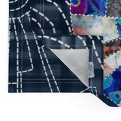 Modern patchwork cheater quilt with Dresden plate block