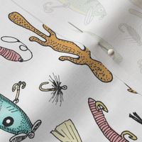 Fishing lures on white tea towel