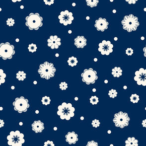 Beige flowers and snow on a dark blue